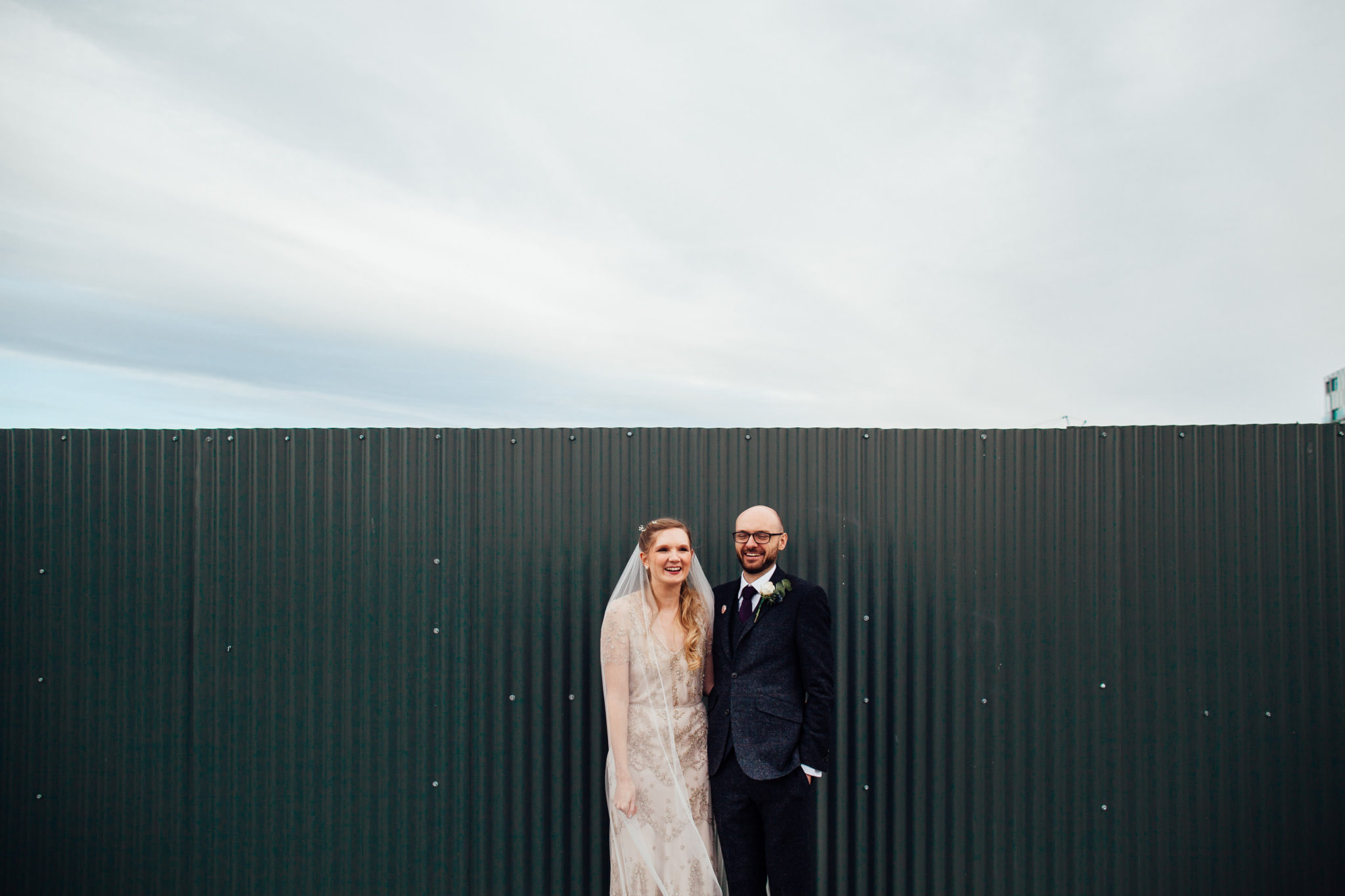 BRIDE AND GROOM AUTUMN WEDDING AT ONE FRIENDLY PLACE COUPLES PORTRAITS WITH PROPS AND DECORATION ROOFTOP OF WAREHOUSE WEDDING IN LONDON
