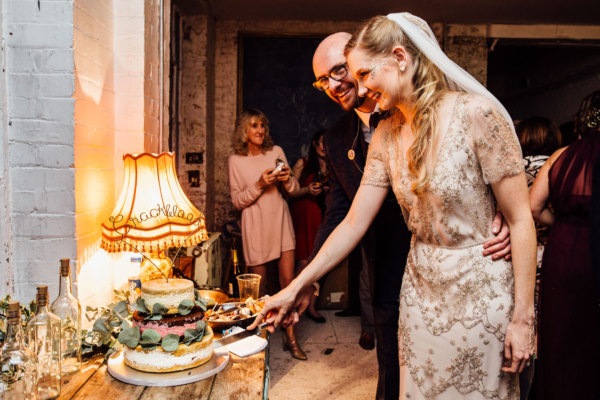 CANDIDS AT WAREHOUSE WEDDING AT ONE FRIENDLY PLACE LONDON DOCUMENTARY FUN WEDDING PHOTOGRAPHY