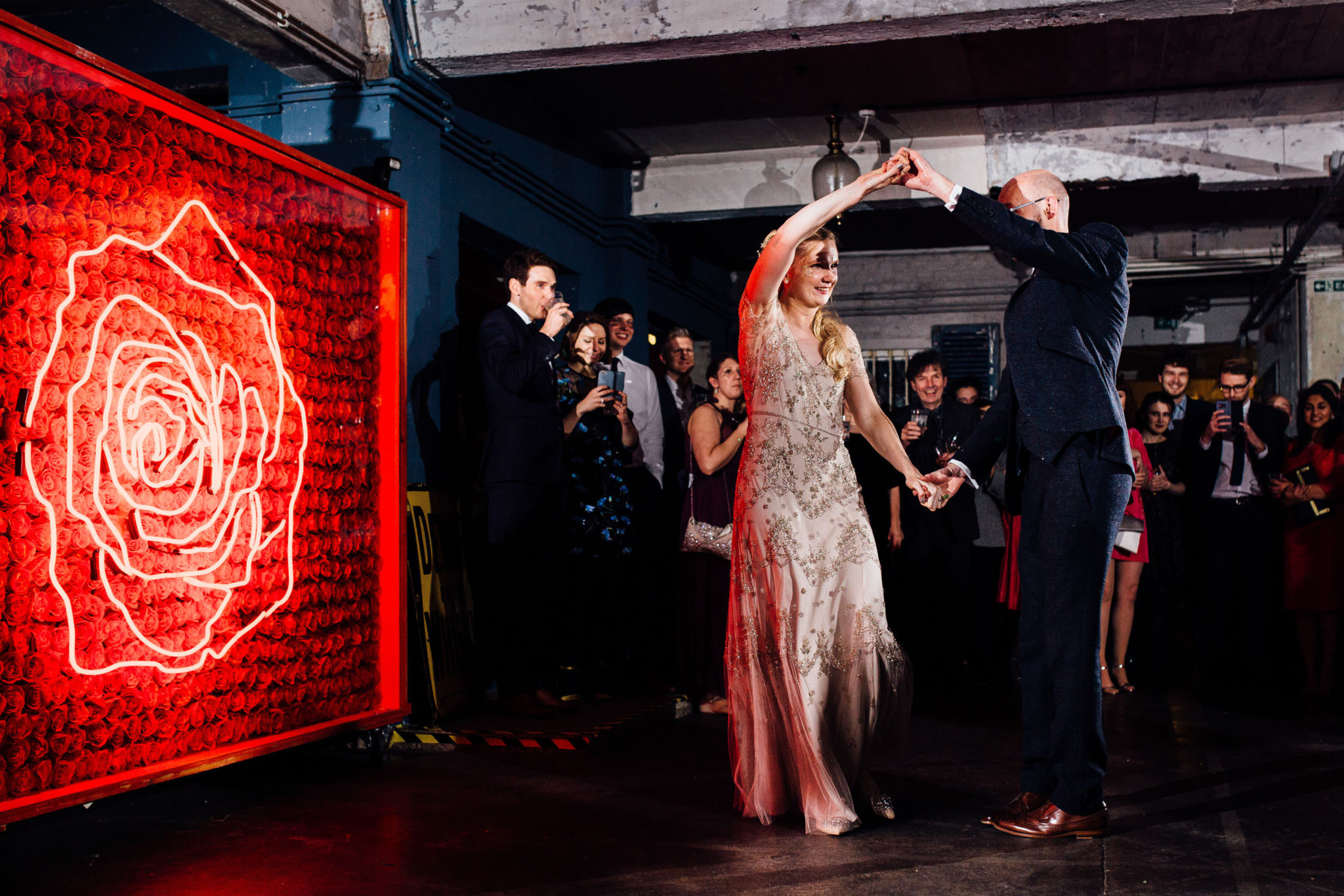 DANCE CANDIDS AT WAREHOUSE WEDDING AT ONE FRIENDLY PLACE LONDON DOCUMENTARY FUN WEDDING PHOTOGRAPHY NEON ROSE