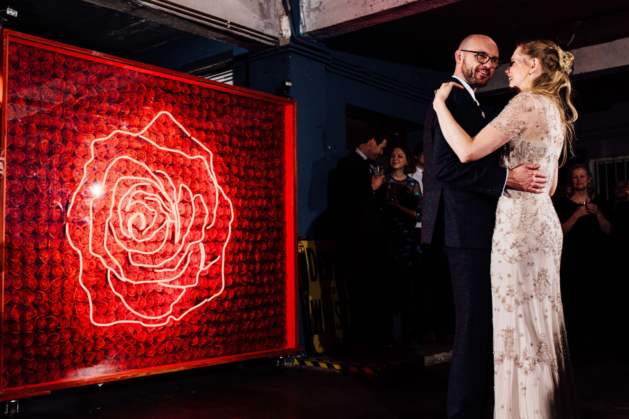 DANCE CANDIDS AT WAREHOUSE WEDDING AT ONE FRIENDLY PLACE LONDON DOCUMENTARY FUN WEDDING PHOTOGRAPHY NEON ROSE