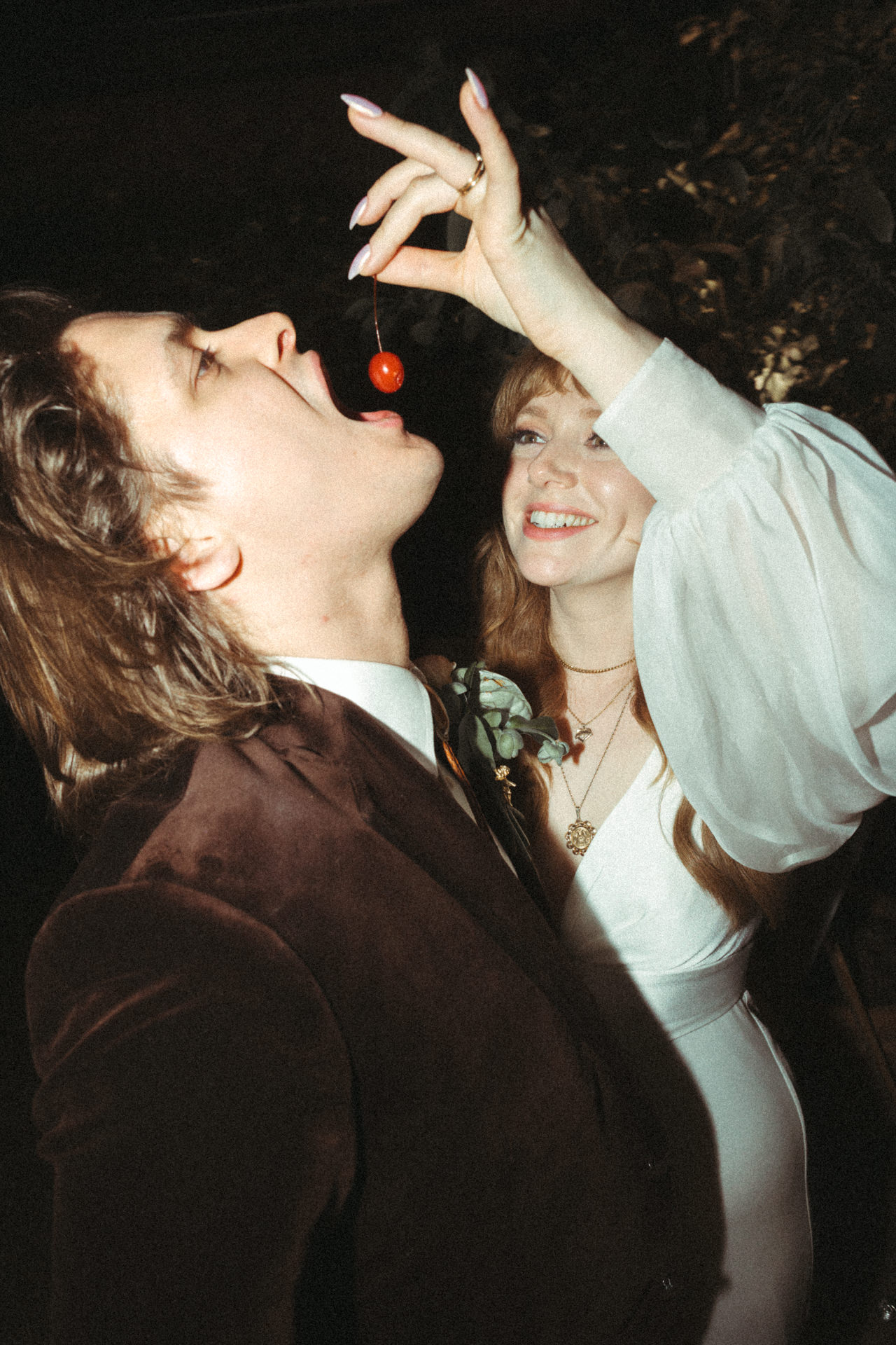 couple feeding each other on their wedding day